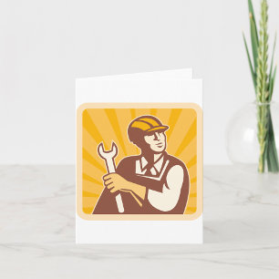 Arbetare med en skiftnyckel kort