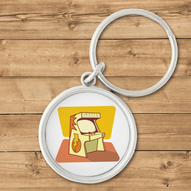 Arcade maskin rund silverfärgad nyckelring (Skapare uppladdad)