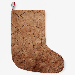 Arid-sprickor med sprickor liten julstrumpa