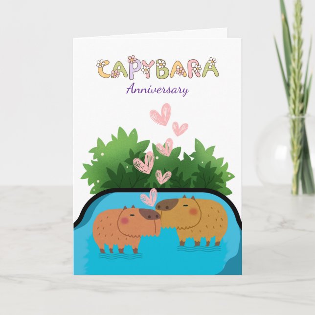 Årsdag: Ett par Capybara Swimming i Vatten Kort (Framsida)