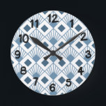 Art Deco Fläkt Rund Klocka<br><div class="desc">Den här väggklockan har en konsdeco-design av dammiga blå diamanter med diagonalt linjer och mörk blått diamanter på fält av vitt.</div>