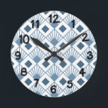 Art Deco Fläkt Rund Klocka<br><div class="desc">Den här väggklockan har en konsdeco-design av dammiga blå diamanter med diagonalt linjer och mörk blått diamanter på fält av vitt.</div>