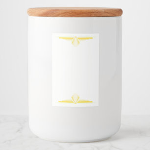 Art deco inslag i lätt gult mat etikett