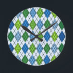 Art Deco Rain Argyle Rund Klocka<br><div class="desc">Den här väggklockan har en konsdeco-design av diamantformer som är tillverkade av överlappande vinklar i färgaden svart linjer i skuggor av blått och grönt med diagonalt svart linjer skapar designen som argyle</div>