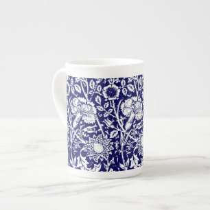 Art nouveau-kolonn, flottan och vit benporslin mugg