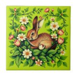 Art Nouveau Wild Rabbit and Flowers Kakelplatta<br><div class="desc">Ceramic tile in an Art Nouveau style illustration,  inspired by the design style of William Morris,  features a brown rabbit nestled among flowing vines,  white daisies,  and pink tulip-like flowers. The design emphasizes intricate botanical motifs,  evocative of Morris's decorative arts.</div>