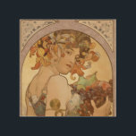 Art nouveau Woman Mucha BeSnyval Trätavla<br><div class="desc">En vacker kvinna - Denna vackra art nouveau-design är av Alfonse Mucho,  kallad "Fruit",  som målades 1897. Det visar en vacker art nouveau-flicka som håller en pansarmassa av frukt - druvor,  päron,  äpplen. I hennes hår är orange blommor. Alphonse Mucha - Art nouveau - Vintage Woman</div>
