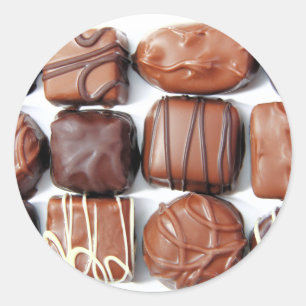 Assorterade choklad runt klistermärke