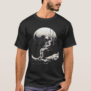 astronaut sittande på gunga i rymden stjärnor och t shirt