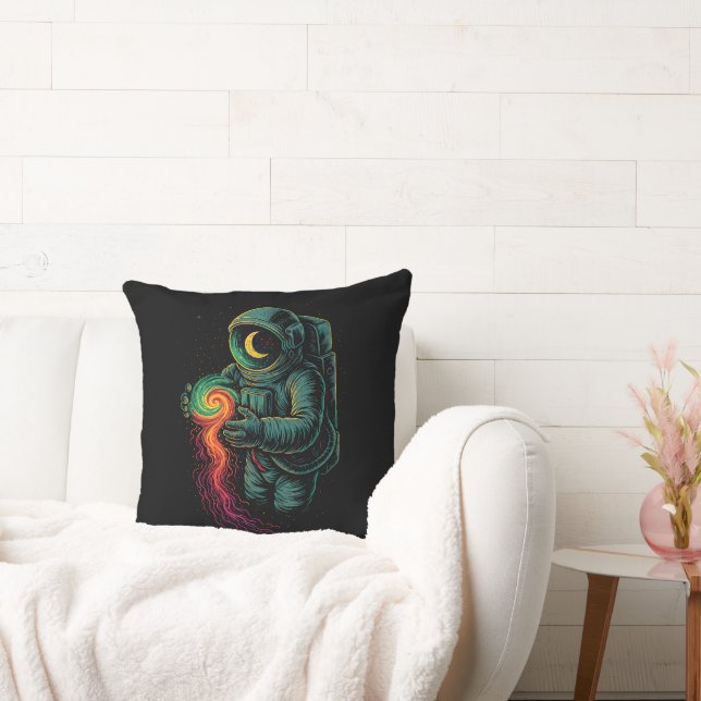 Astronaut som håller en kosmisk spiral kudde (Soffa)
