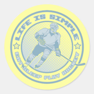 Ät, viloläge, spela upp hockey-stickers runt klistermärke
