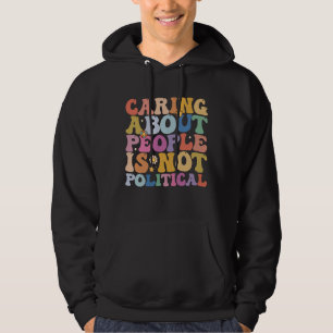 Att bry sig om människor är ingen politisk groovy hoodie