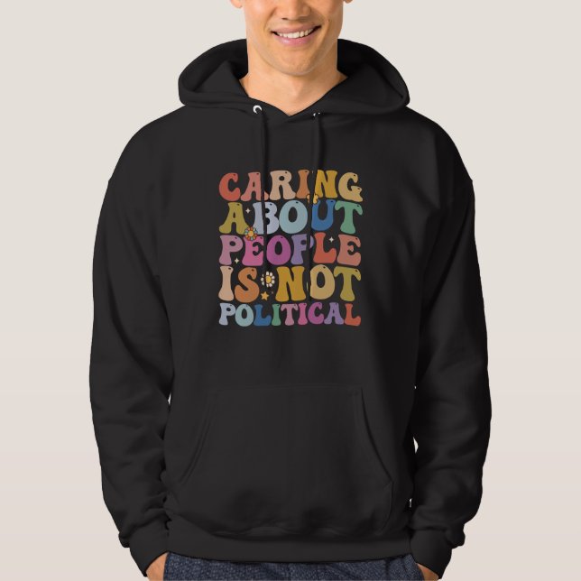 Att bry sig om människor är ingen politisk groovy  hoodie (Framsida)