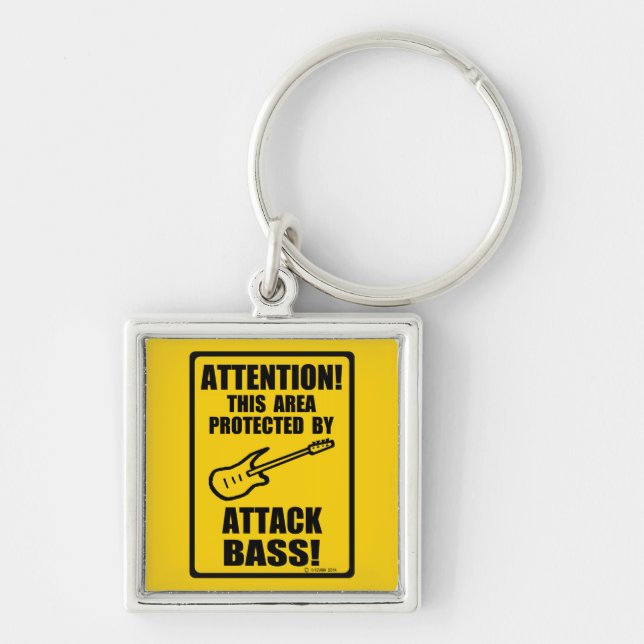 Attack Bass Fyrkantig Silverfärgad Nyckelring (Framsidan)