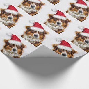 Australian shepherd i jultomten presentpapper