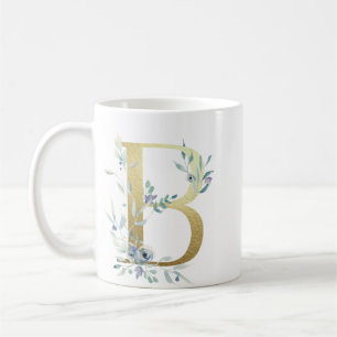 B guld initialt med blå blommigt löv kaffemugg