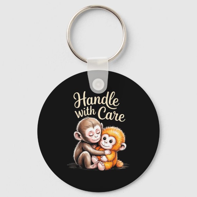 Baby apa slår  nyckelring (Framsida)