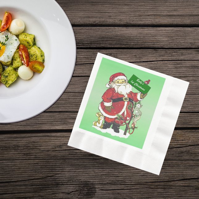 Baby First jul Cute Santa Sign Pappersservett (Cute Santa Clause with tree little forest animals in snow on green Christmas paper napkins.)