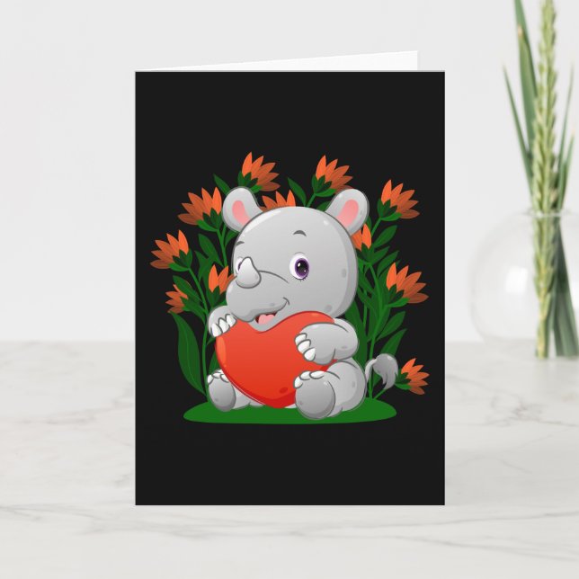 baby rhino håller i färgadens hjärtballong kort (Framsida)