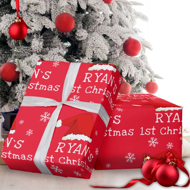 Baby`s första jul röda tomteluva snöflinga presentpapper (Skapare uppladdad)