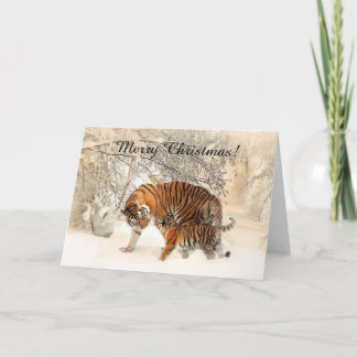Baby tiger och Tiger mamma i en snöskog Helgkort