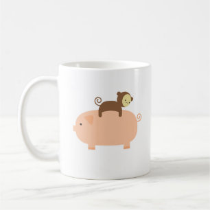 Babyaparidning på en gris kaffemugg