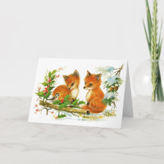 Babyjulrävar och fågel med järnek helgkort