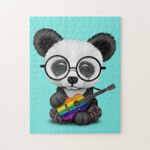 BabyPanda som leker regnbågeflaggagitarren Pussel