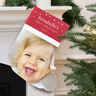 Baby's första julfoto röda liten julstrumpa