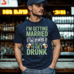Bachelor Party Drinking Team Groom Design T Shirt<br><div class="desc">Få redo för den ultimata bachelor-bash med den här vintagen "Jag är Gifta sig,  de andra är bara här för att få rökning"-design. Perfekt för den blivande gruppen och hans party-trupp,  det för humor,  roligt och fet stil till er firande före bröllop.</div>