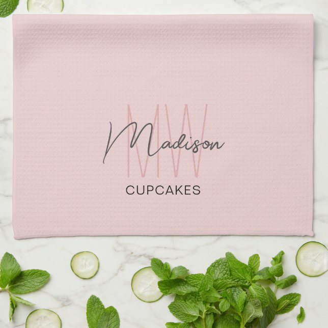 Bakery med monogramlogotyp rosa kökshandduk (Vikta)