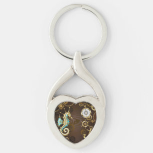 Bakgrund av trä med mekanisk sjöhäst twisted heart silverfärgad nyckelring