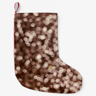 Bakgrund guld glitter struktur. Selektivt fokus.S Liten Julstrumpa