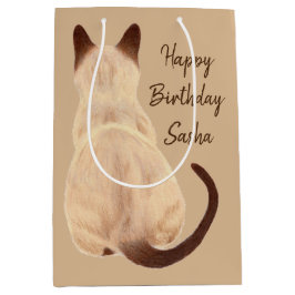 Baksida för Sasha beskådar Siamese kattsitta