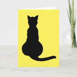 Bakvy över en oefterställd svart katt-silhouette kort