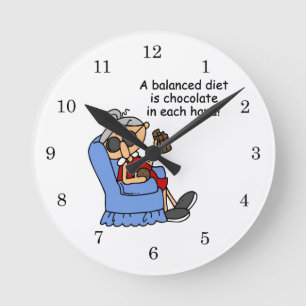 Balanserat choklad-kostat rund klocka