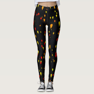Ballonger med rött och gult, svart bakgrund som sl leggings