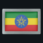 Bälte Buckle med Flagga Etiopien<br><div class="desc">Det här bälte-låsbeslaget som fångar öga och som innehåller Etiopiens Flagga är ett djärvt biet som lägger en patriotisk beröring på alla utrustningar. Genom att visa den pulserande grönten, gulten och det röda färgen med det ikoniska emblemet i centrum, är detta låsbeslag i bälte en perfekt för dem som tar...</div>