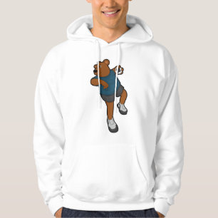Bär vid handbollsspelare med handboll hoodie