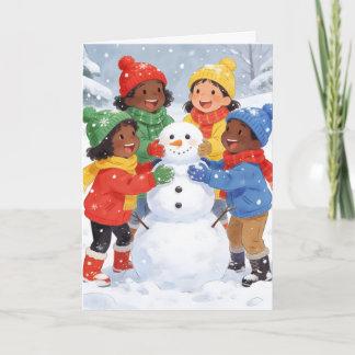Barn bygger en snöman helgkort
