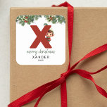 Barn - första X-jul Fyrkantigt Klistermärke<br><div class="desc">Ge är personligens charm i julklapp! Våra monogramklistermärken,  som visar tomtens eget gömmande bakom brev X,  är ett unikt och tänkbart sätt att visa kärlek. Anpassa med namn,  år och hälsning. Få dina julklappar att framträda!</div>
