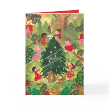 Barn i Julgran efter dekorerad grönt