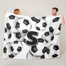 Barn i monogrammet över stora fotbollar