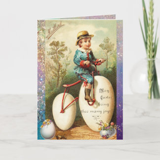 BARN MED PÅSKÄGG CYKEL OCH FÄRGSATTA BLOMMOR HELGKORT