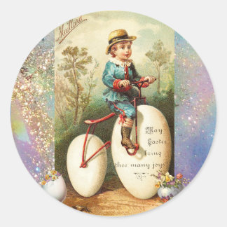 BARN MED PÅSKÄGG CYKEL OCH FÄRGSATTA BLOMMOR RUNT KLISTERMÄRKE