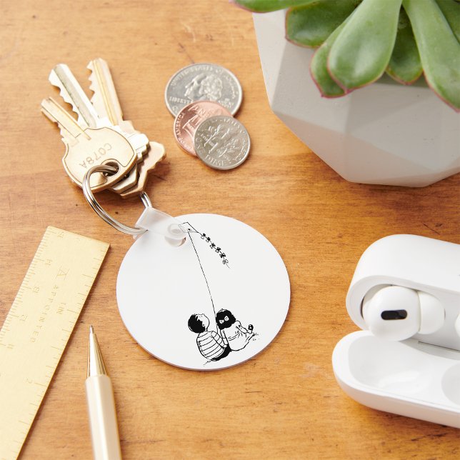 Barn som flyger från en Kite-nyckelkedja Nyckelring (Skapare uppladdad)