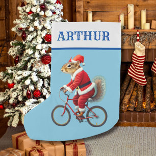 Barnets julsock-ekorre på en cykel liten julstrumpa