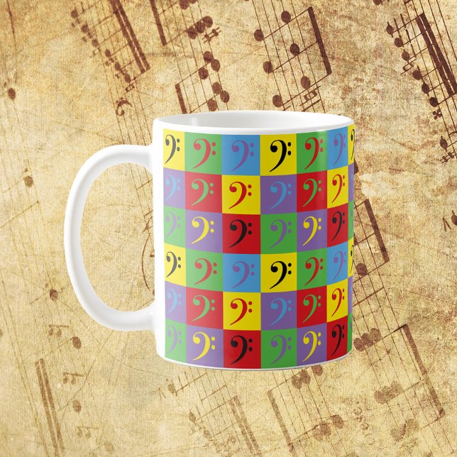 Bass Clef Music Pop Art Rainbow Mönster Kaffemugg (A mug with a pop art pattern of bass clef music symbols)