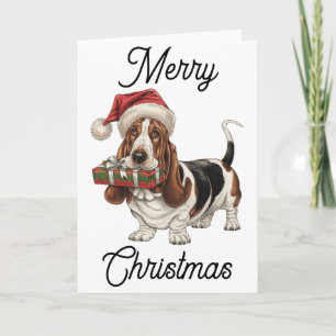 Basset Hound i tomtehatt med present i munnen Kort