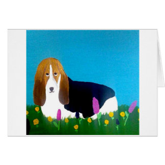 Basset i ett fält av blommor OBS kort